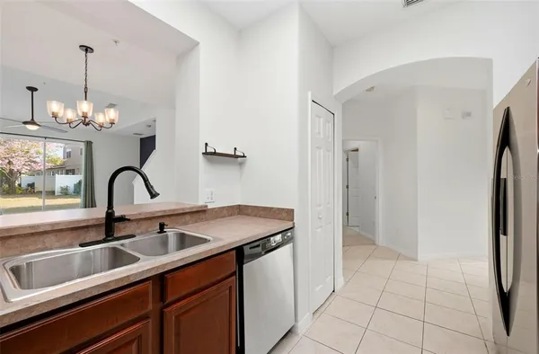 a kitchen with a sink and a refrigerator