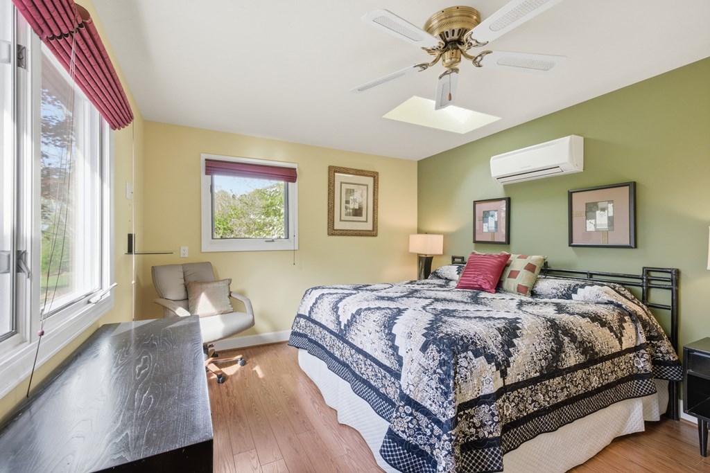 6203 Airport Road Andrews, NC 28901 - Photo 25 of 50 a bedroom with a bed and a chandelier