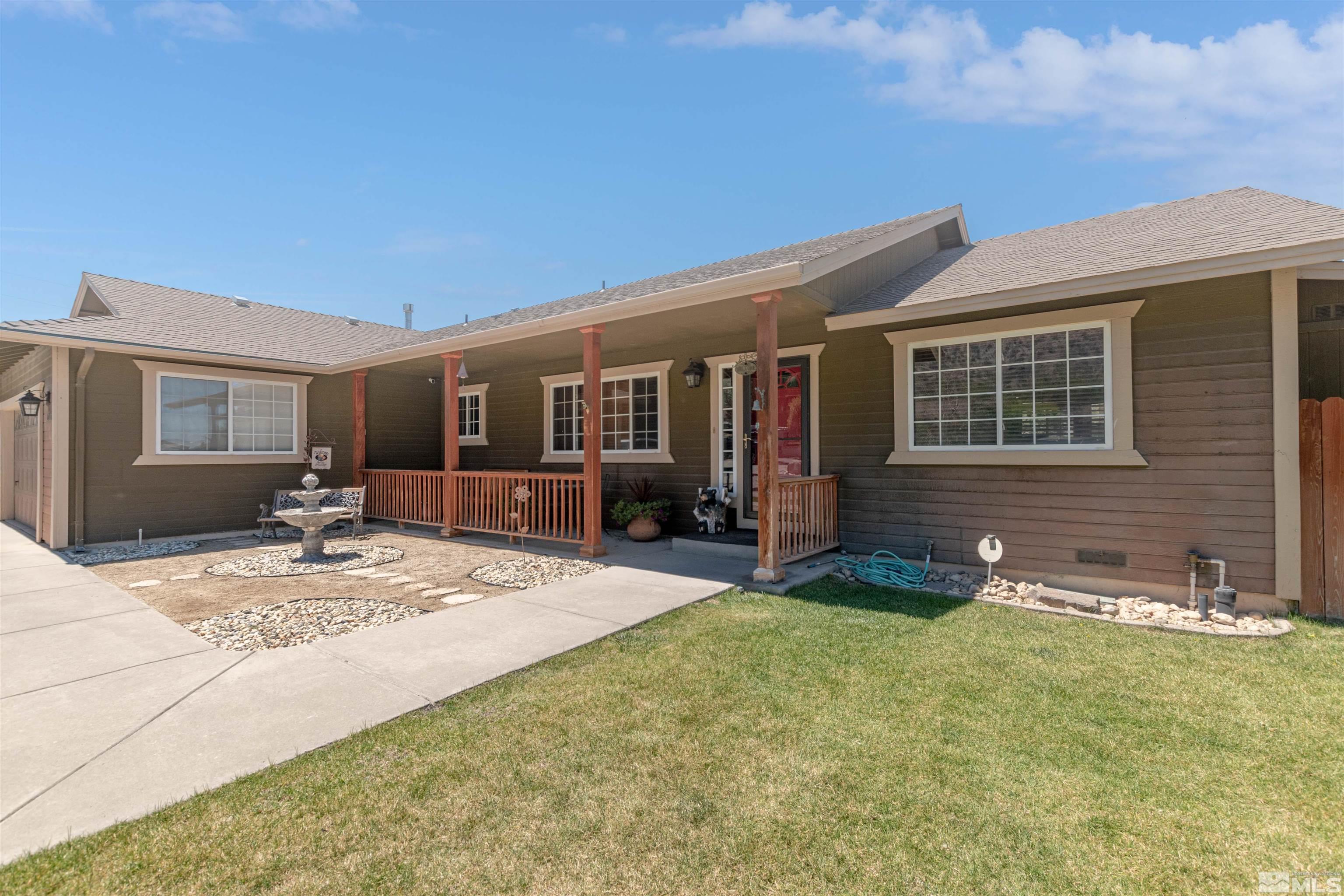 13755 Rancheros Drive Reno, NV 89521 - Photo 1 of 24 a view of a house with backyard and sitting area
