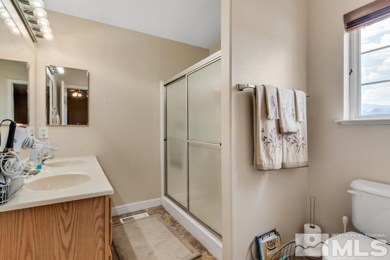 13755 Rancheros Drive Reno, NV 89521 - Photo 12 of 24 a bathroom with a sink and a mirror
