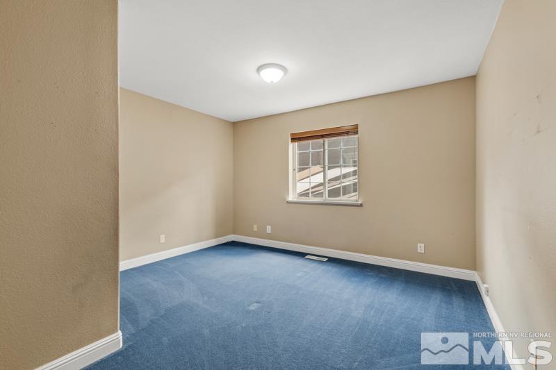 13755 Rancheros Drive Reno, NV 89521 - Photo 13 of 24 an empty room with a workspace