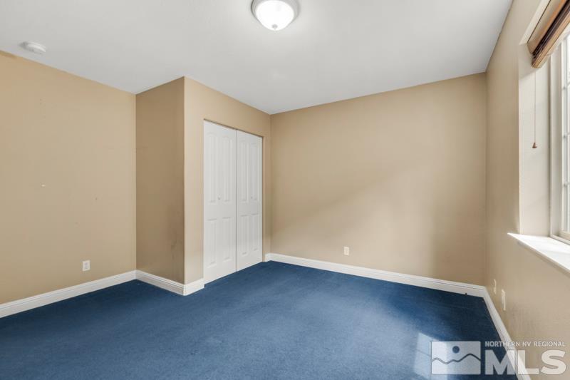 13755 Rancheros Drive Reno, NV 89521 - Photo 14 of 24 an empty room with a empty space and a window