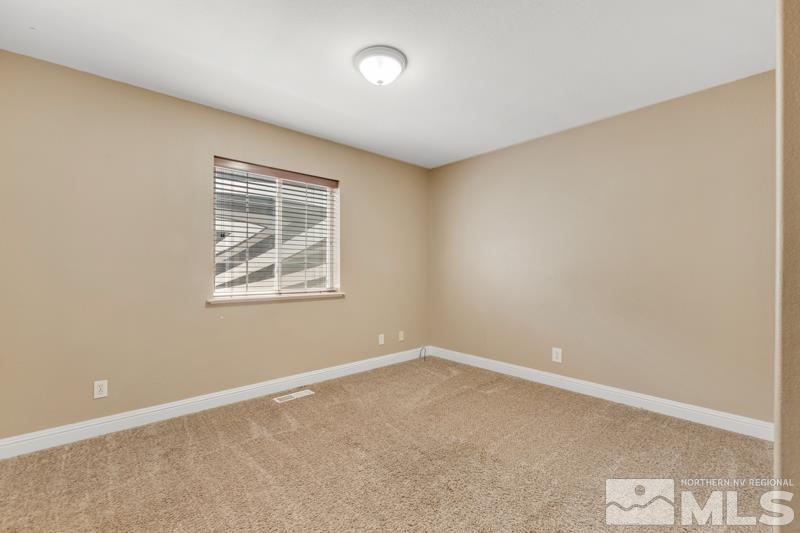13755 Rancheros Drive Reno, NV 89521 - Photo 15 of 24 an empty room with windows
