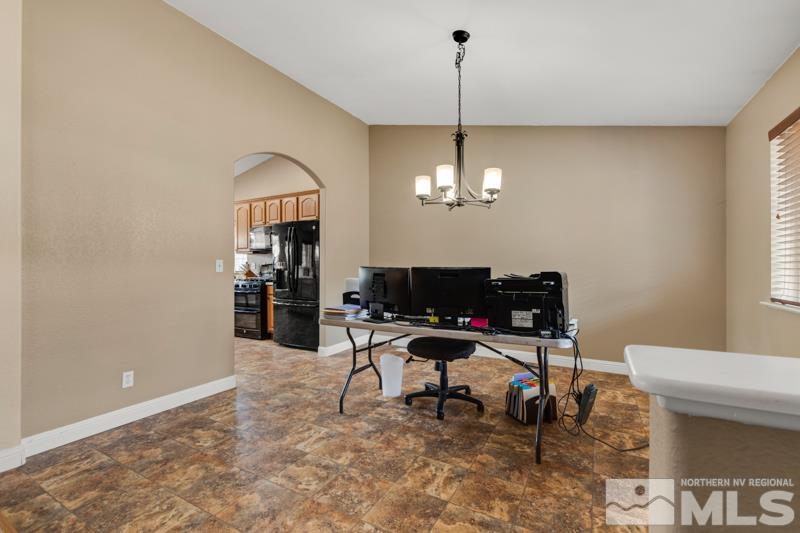 13755 Rancheros Drive Reno, NV 89521 - Photo 18 of 24 a view of a workspace with furniture and a window