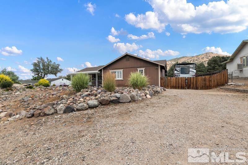 13755 Rancheros Drive Reno, NV 89521 - Photo 22 of 24 a front view of a house with a yard
