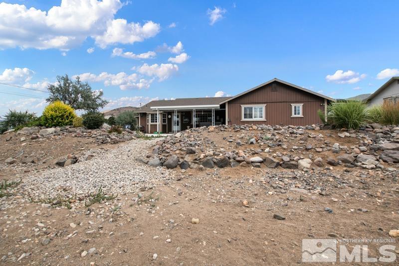 13755 Rancheros Drive Reno, NV 89521 - Photo 23 of 24 a front view of a house with a yard