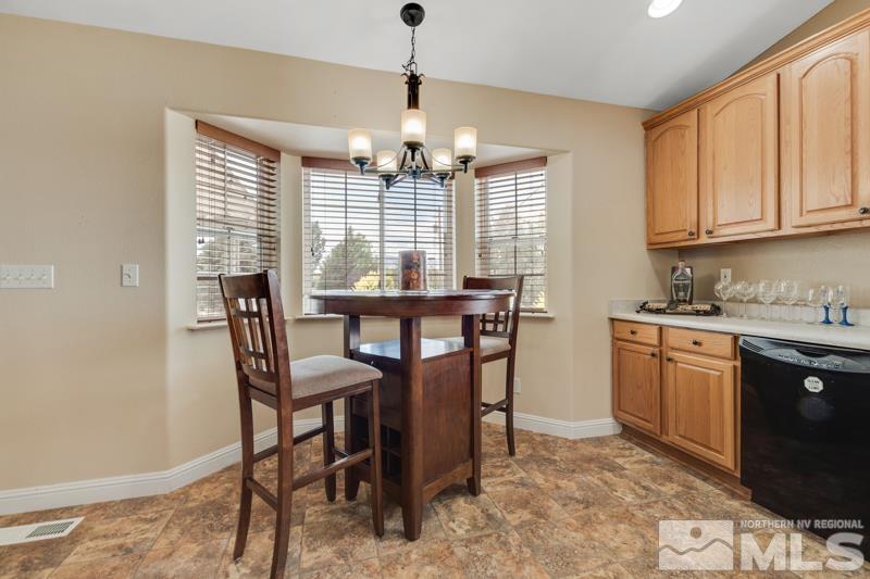 13755 Rancheros Drive Reno, NV 89521 - Photo 6 of 24 a view of a dining room with furniture window and outside view
