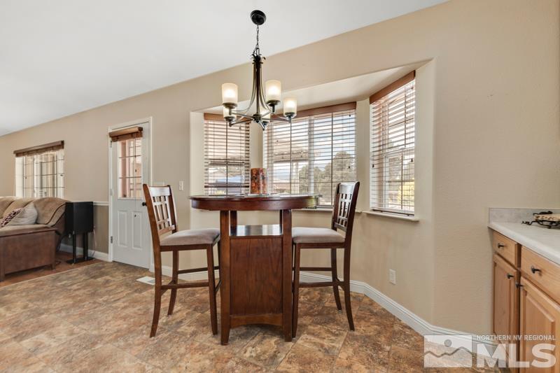 13755 Rancheros Drive Reno, NV 89521 - Photo 7 of 24 a view of a dining room with furniture