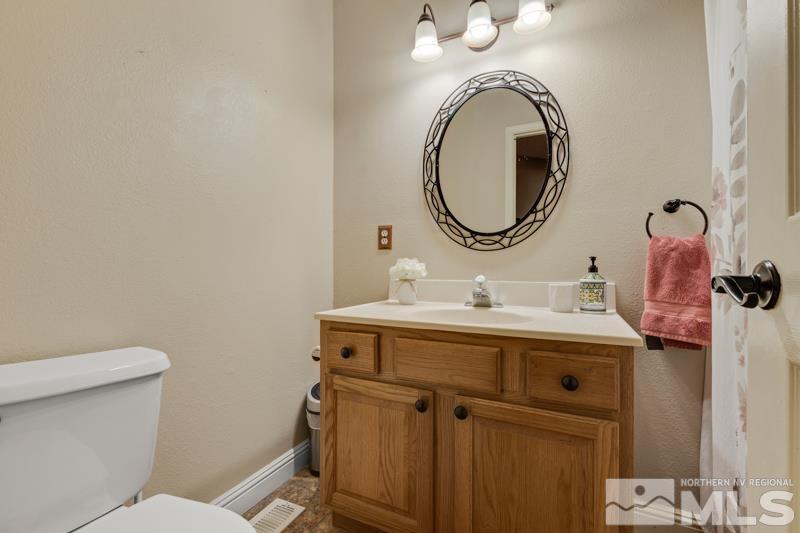 13755 Rancheros Drive Reno, NV 89521 - Photo 9 of 24 a bathroom with a sink and a mirror