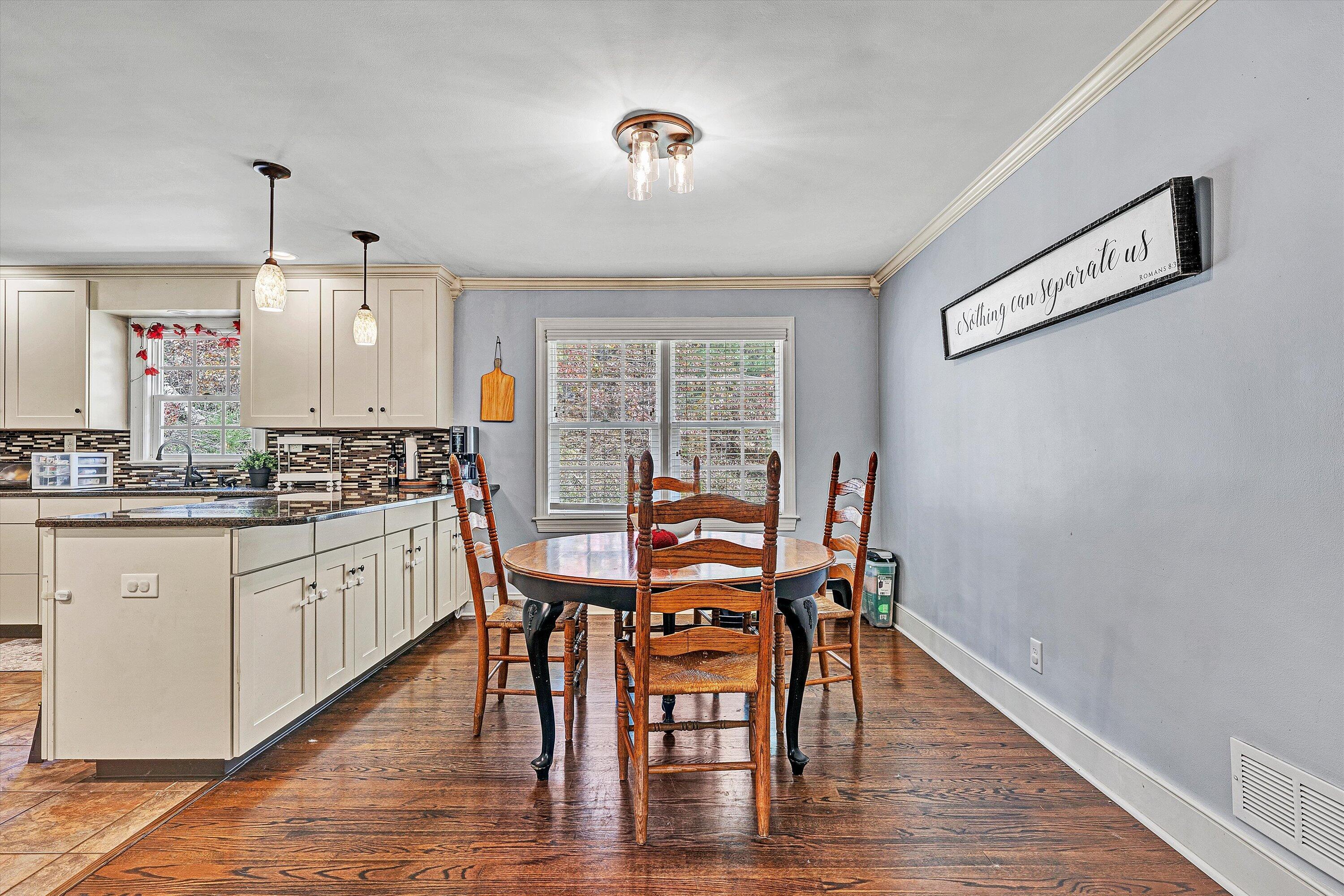 2320 Grassy Hill Road Rocky Mount, VA 24151 - Photo 12 of 57 a kitchen with stainless steel appliances granite countertop a dining table chairs and granite counter tops