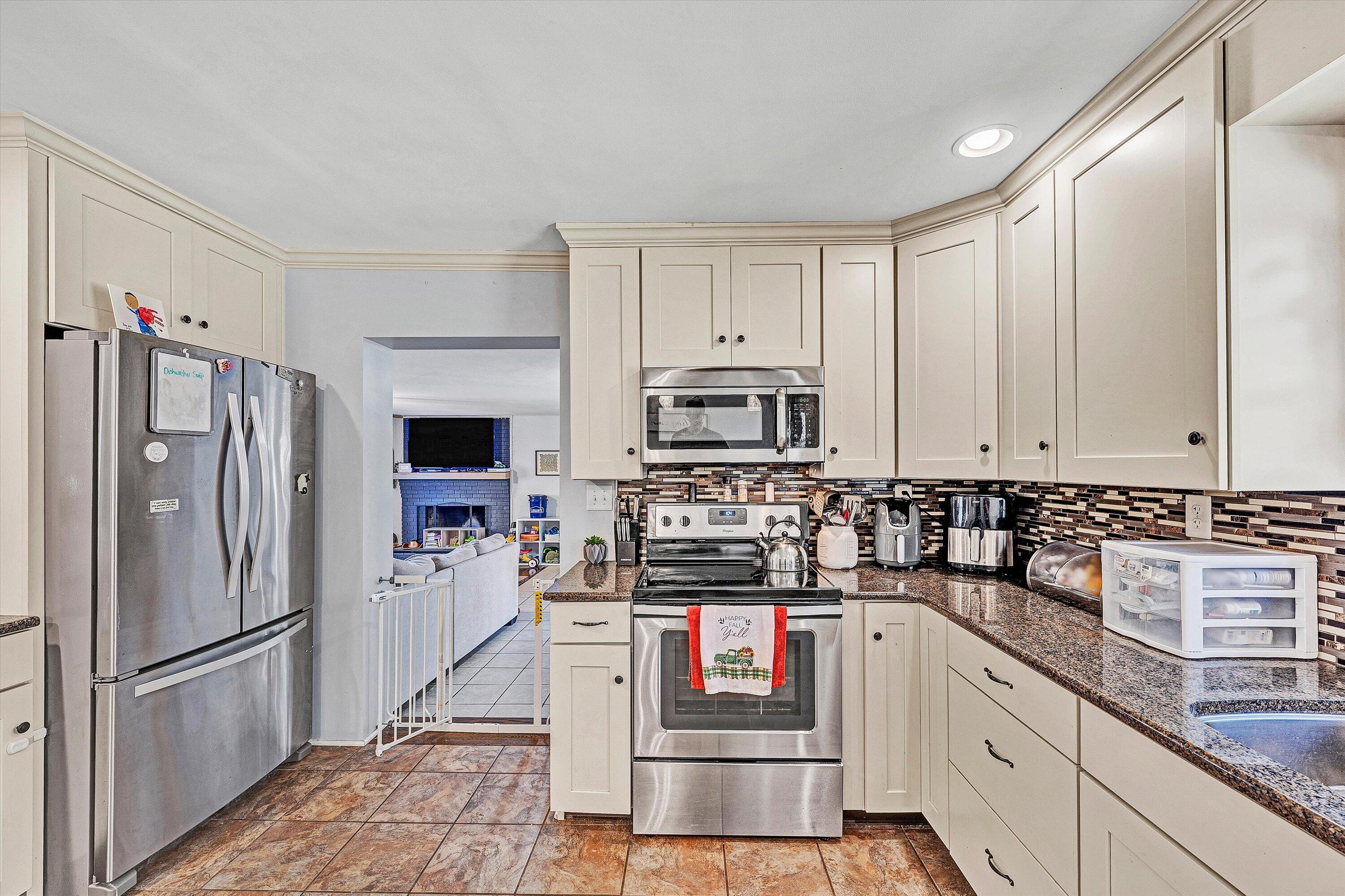 2320 Grassy Hill Road Rocky Mount, VA 24151 - Photo 16 of 57 a kitchen with stainless steel appliances granite countertop a refrigerator sink and stove