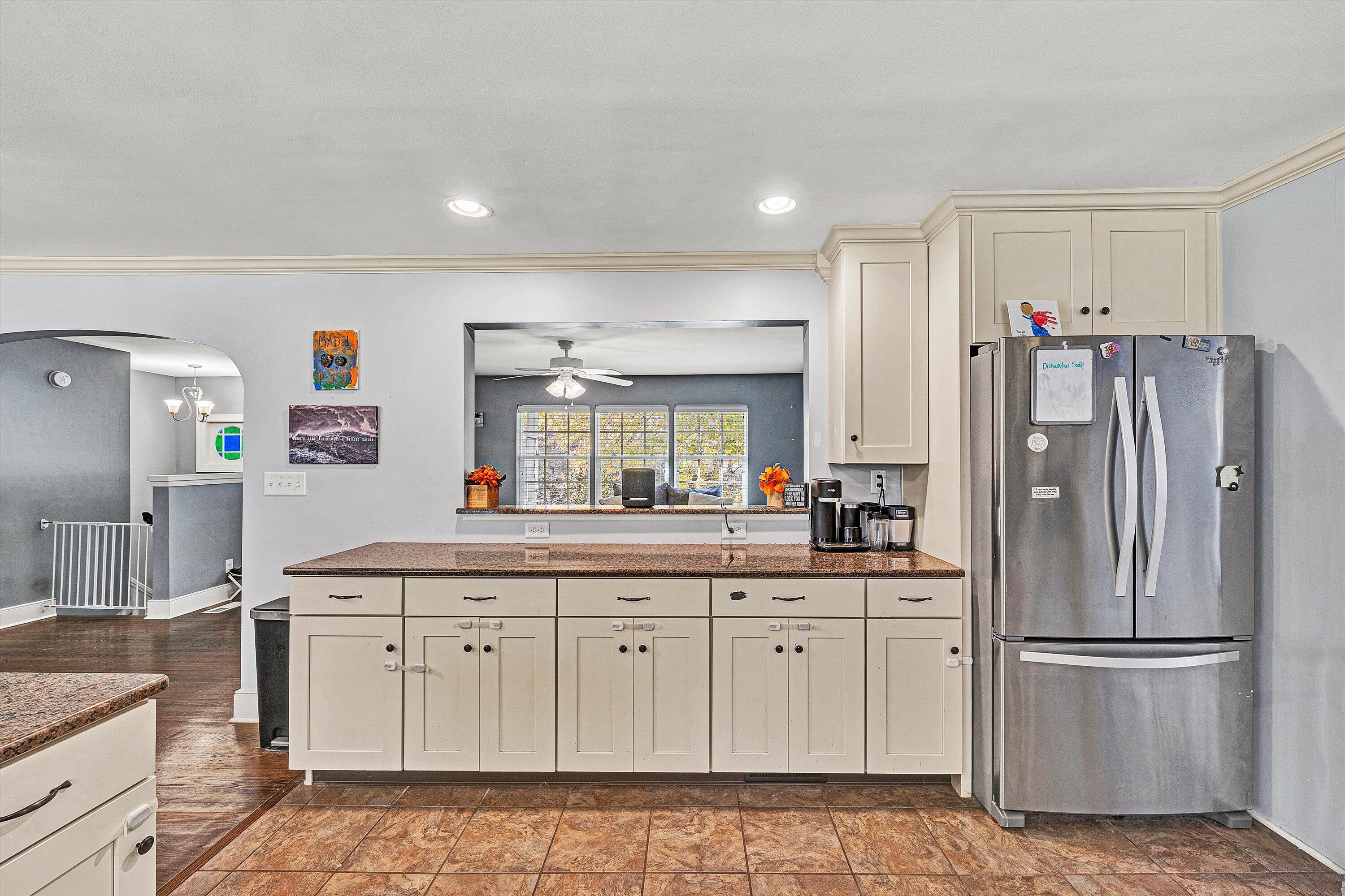 2320 Grassy Hill Road Rocky Mount, VA 24151 - Photo 19 of 57 a kitchen with white cabinets and refrigerator
