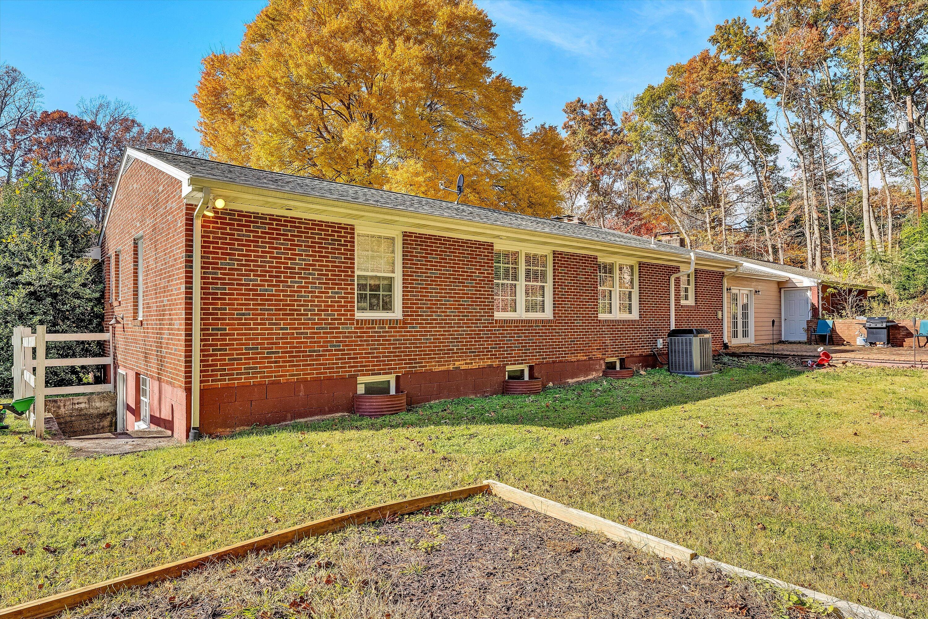 2320 Grassy Hill Road Rocky Mount, VA 24151 - Photo 39 of 57 a view of a backyard with plants and large tree