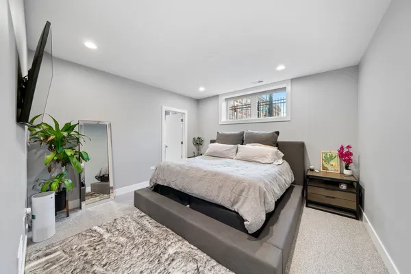 a bedroom with a bed and a couch