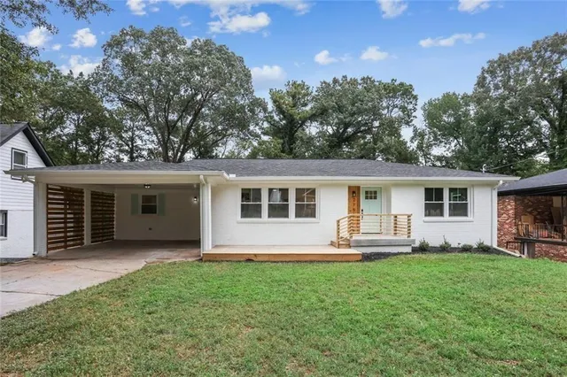 a front view of house with yard and outdoor seating