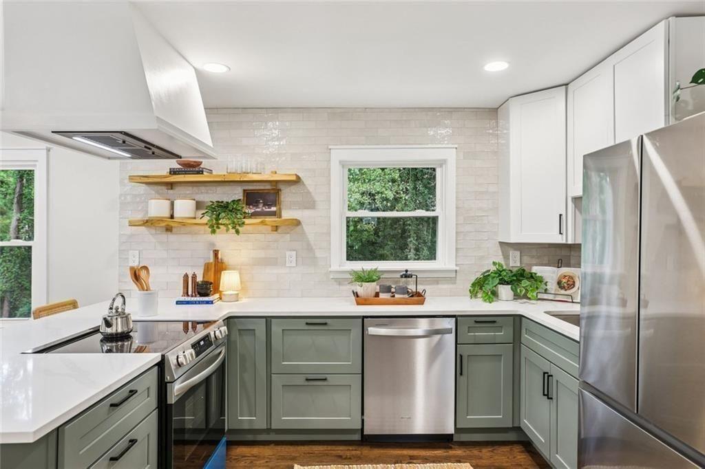 2152 Edgemore Drive Southeast Atlanta, GA 30316 - Photo 12 of 33 a kitchen with a sink stove and refrigerator