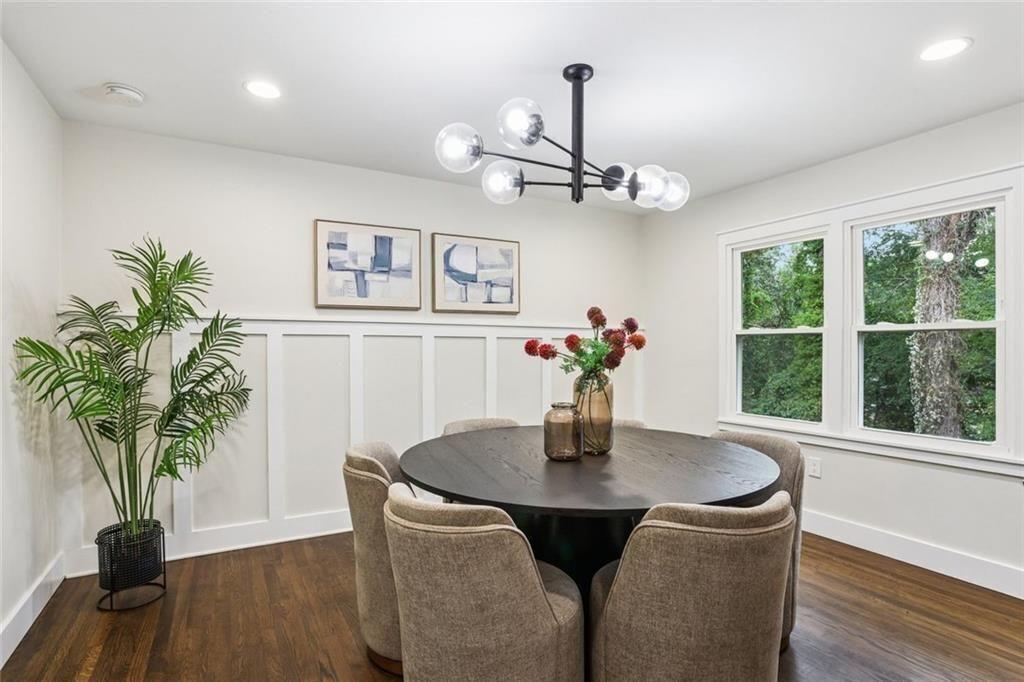 2152 Edgemore Drive Southeast Atlanta, GA 30316 - Photo 13 of 33 a dining room with furniture potted plants and wooden floor