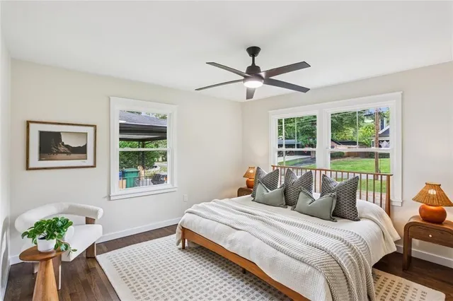 a bedroom with a large bed and a window