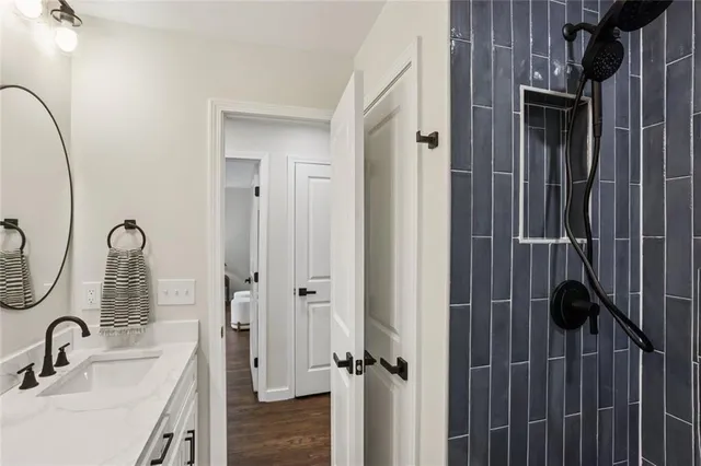 a bathroom with a sink and a mirror