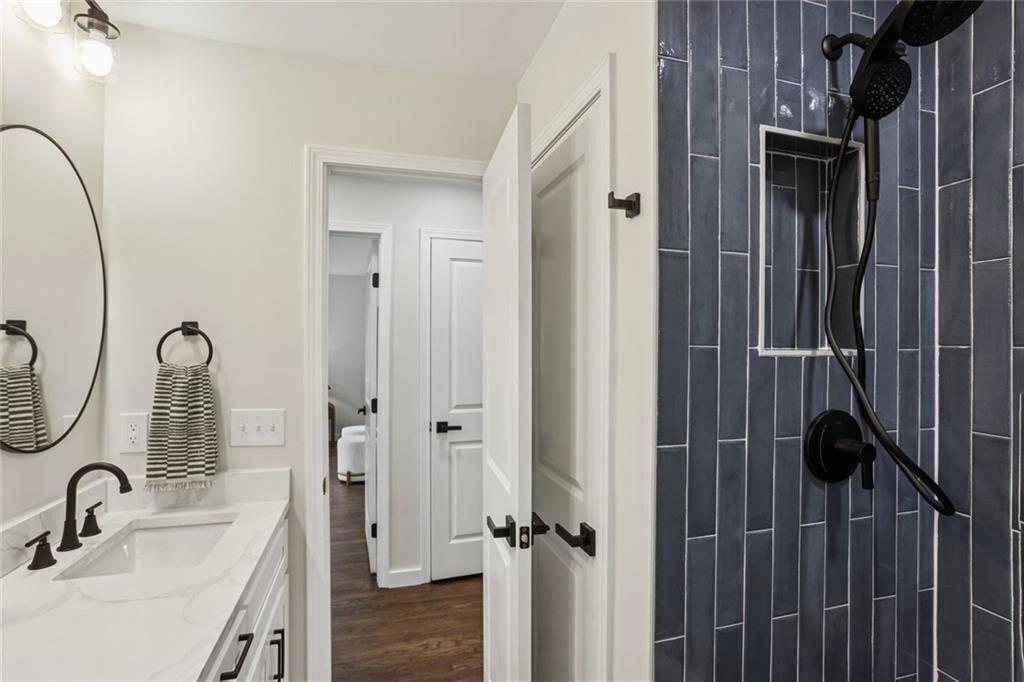 2152 Edgemore Drive Southeast Atlanta, GA 30316 - Photo 17 of 33 a bathroom with a sink and a mirror