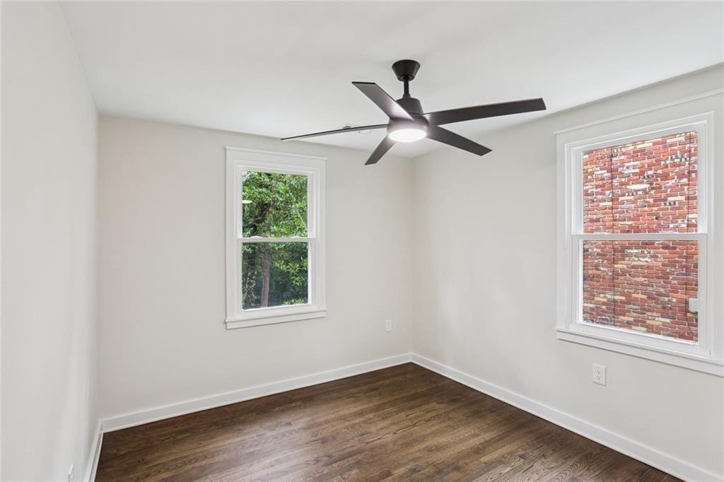 2152 Edgemore Drive Southeast Atlanta, GA 30316 - Photo 25 of 33 a view of a big room with wooden floor closet and windows
