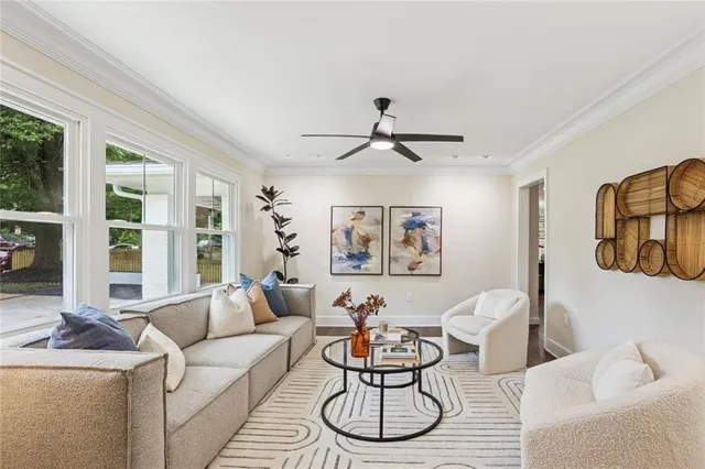 a living room with furniture and a large window