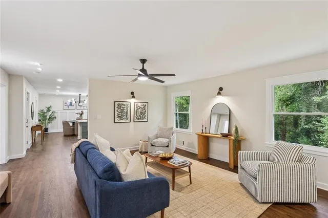 a living room with furniture and a large window