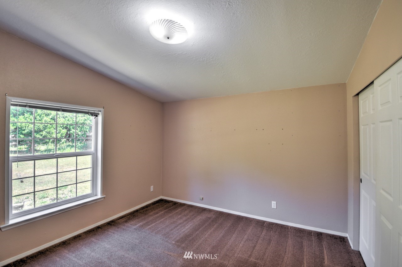 17327 Sargent Road Southwest Rochester, WA 98579 - Photo 13 of 23 an empty room with a window