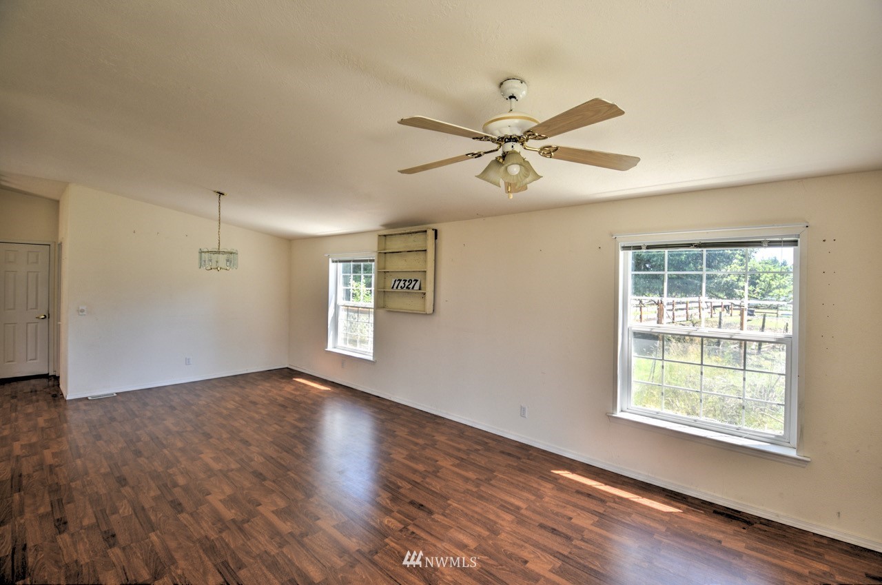 17327 Sargent Road Southwest Rochester, WA 98579 - Photo 18 of 23 a view of empty room with wooden floor and fan