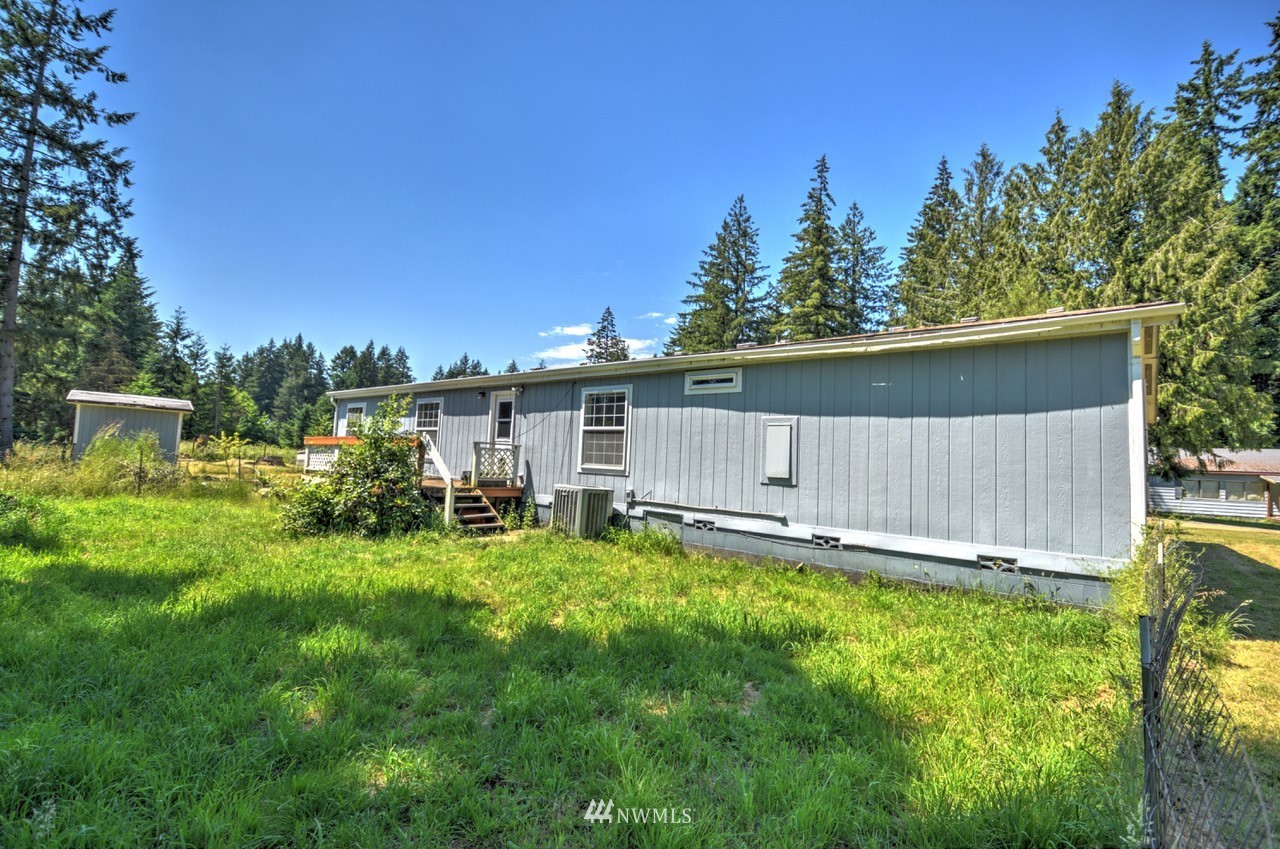 17327 Sargent Road Southwest Rochester, WA 98579 - Photo 20 of 23 a view of a house with backyard and sitting area