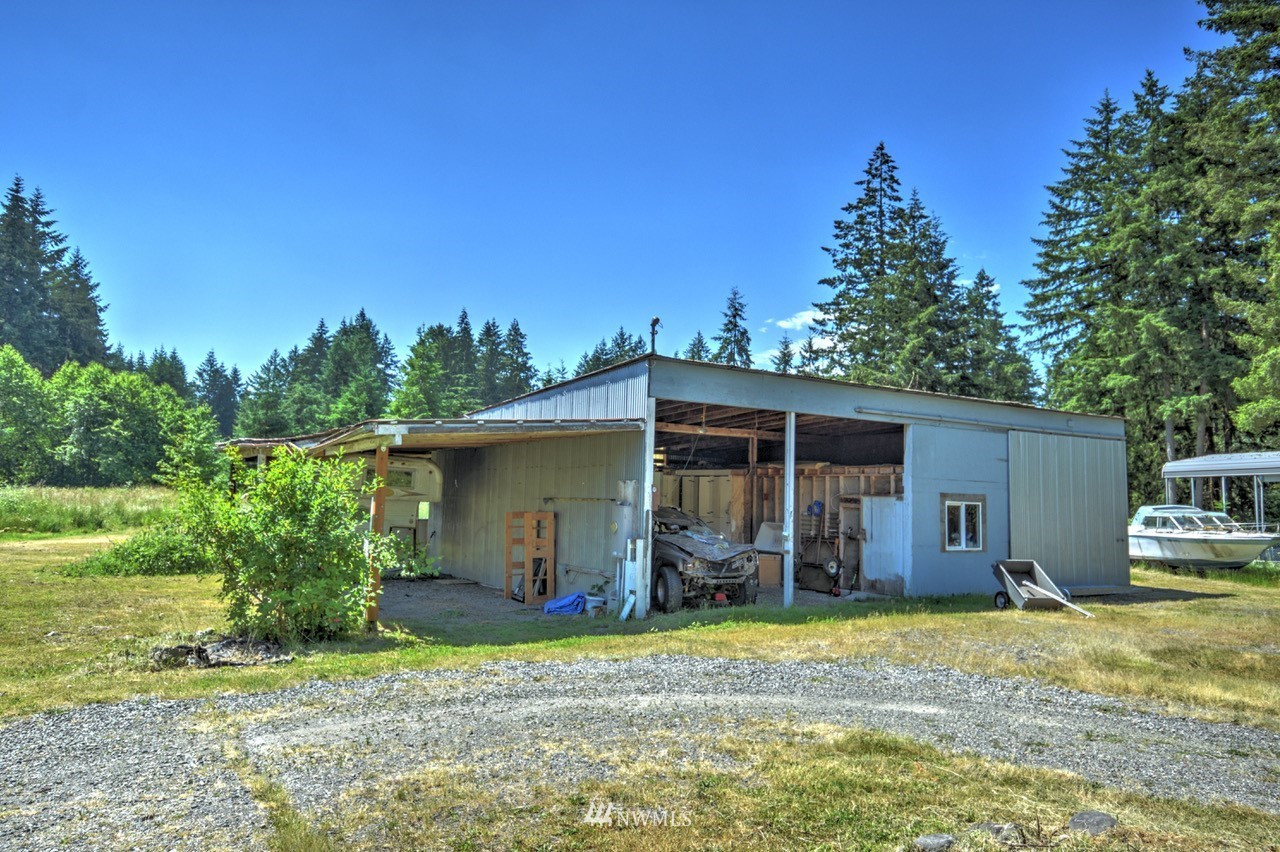 17327 Sargent Road Southwest Rochester, WA 98579 - Photo 21 of 23 a view of a house with backyard and garden
