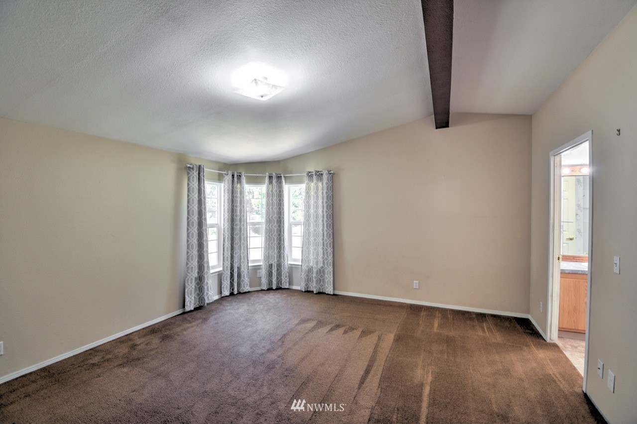 17327 Sargent Road Southwest Rochester, WA 98579 - Photo 8 of 23 an empty room with windows and closet