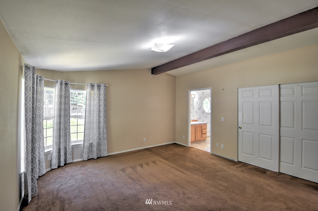 17327 Sargent Road Southwest Rochester, WA 98579 - Photo 9 of 23 an empty room with windows