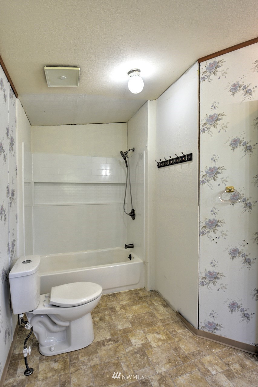 17327 Sargent Road Southwest Rochester, WA 98579 - Photo 10 of 23 a bathroom with a toilet and a shower