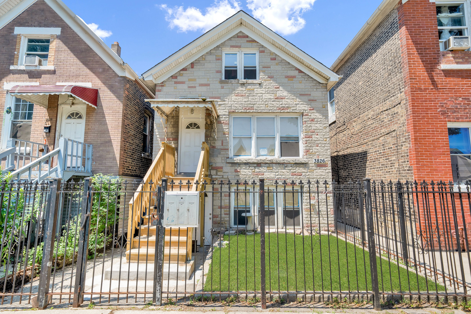 3826 South Honore Street Chicago, IL 60609 - Photo 2 of 19 a view of a house with iron stairs