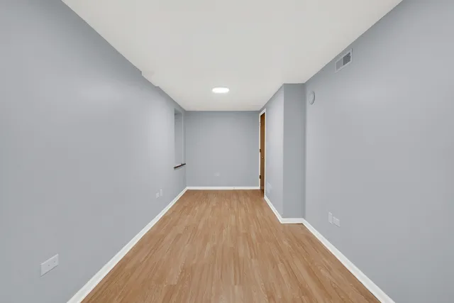 a view of a big room with wooden floor