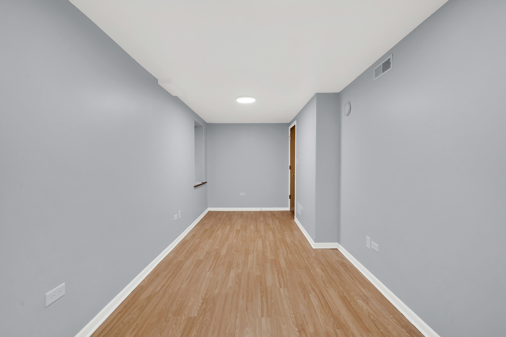 3826 South Honore Street Chicago, IL 60609 - Photo 10 of 19 a view of a big room with wooden floor