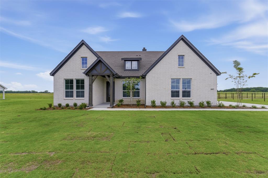 Contemporary brick exterior with dark trim accents and a prominent covered entry