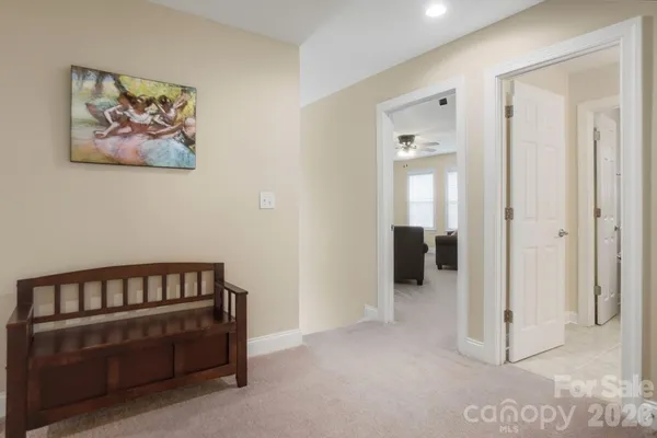 a bedroom with a bed dresser and a window