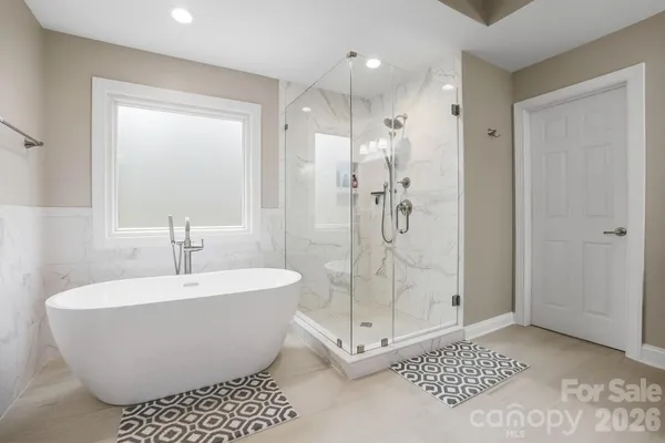 a white bath tub sitting in a bathroom