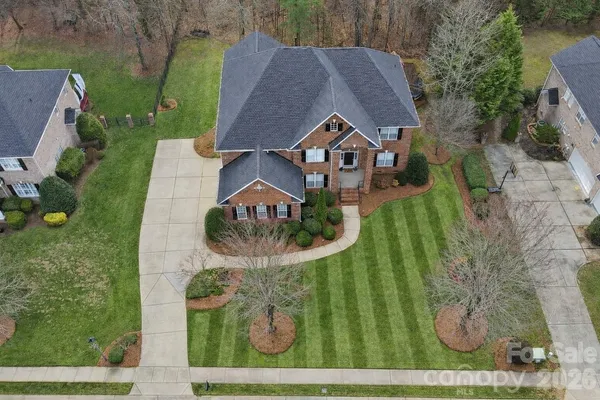an aerial view of a house with outdoor space