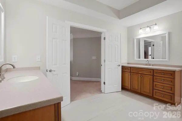 a spacious bedroom with a bed and a window