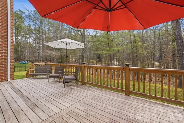 a view of a backyard with large trees
