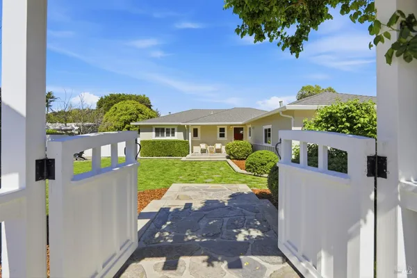 a front view of a house with garden