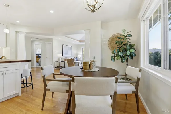a view of a dining room with furniture and window