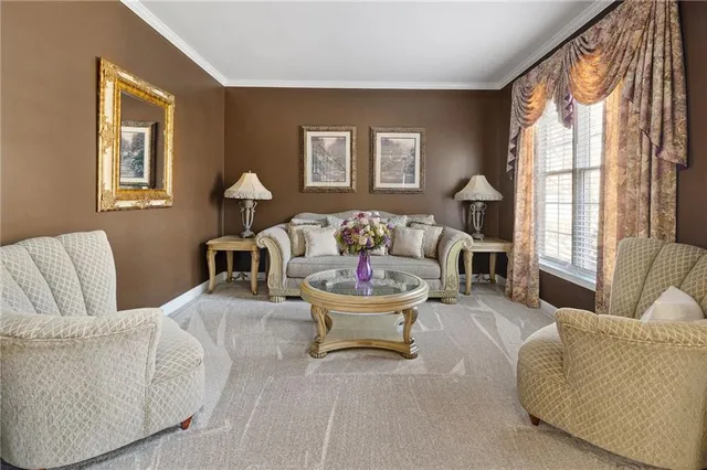 a kitchen with stainless steel appliances granite countertop a stove top oven a sink dishwasher and wooden cabinets with wooden floor