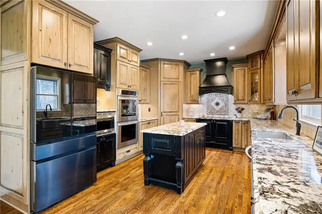 a living room with furniture windows and flat screen tv