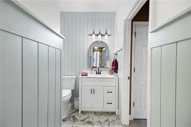 a spacious bedroom with a bed and window