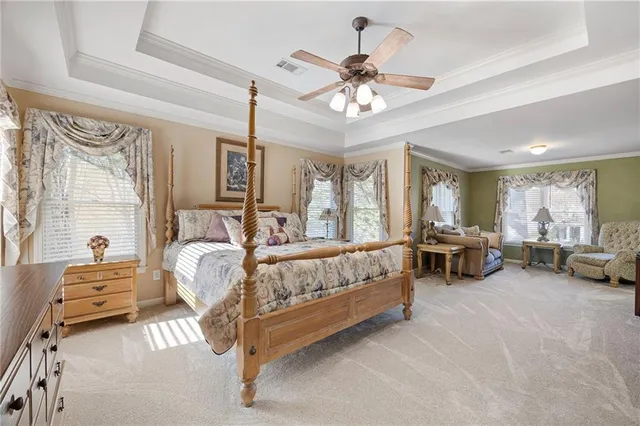 a bedroom with furniture and a window