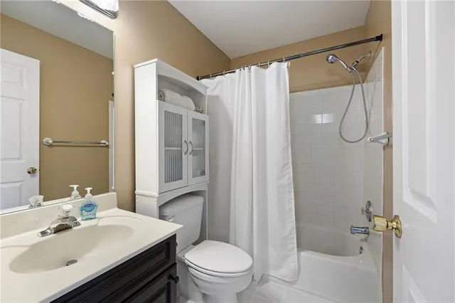 a view of a yard with plants and trees